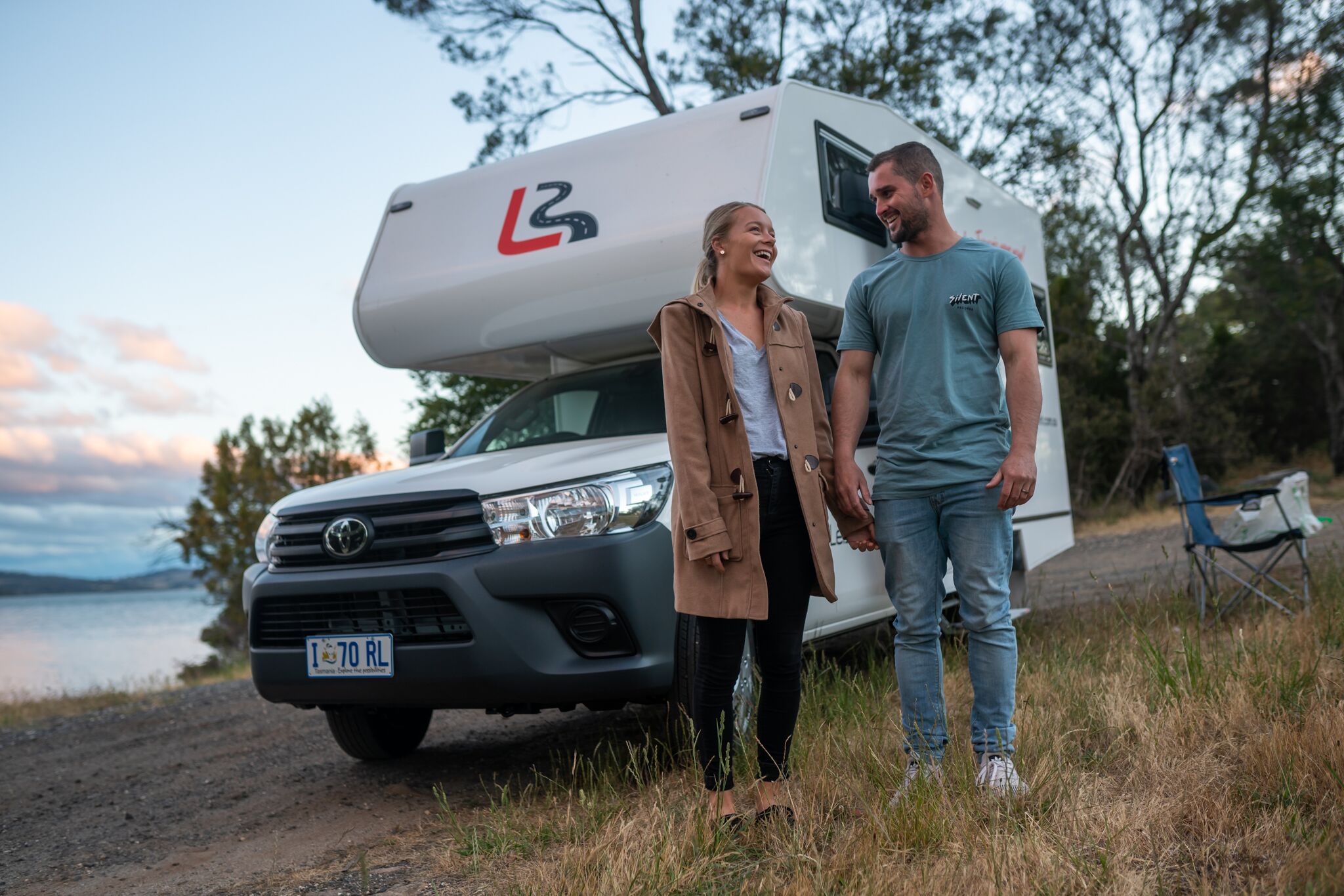 couple at front of motorhome