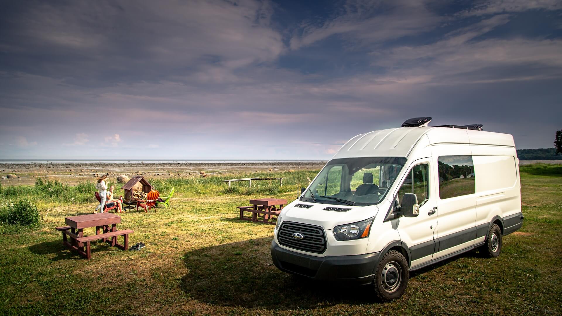 campervan vehicle with people in the outback